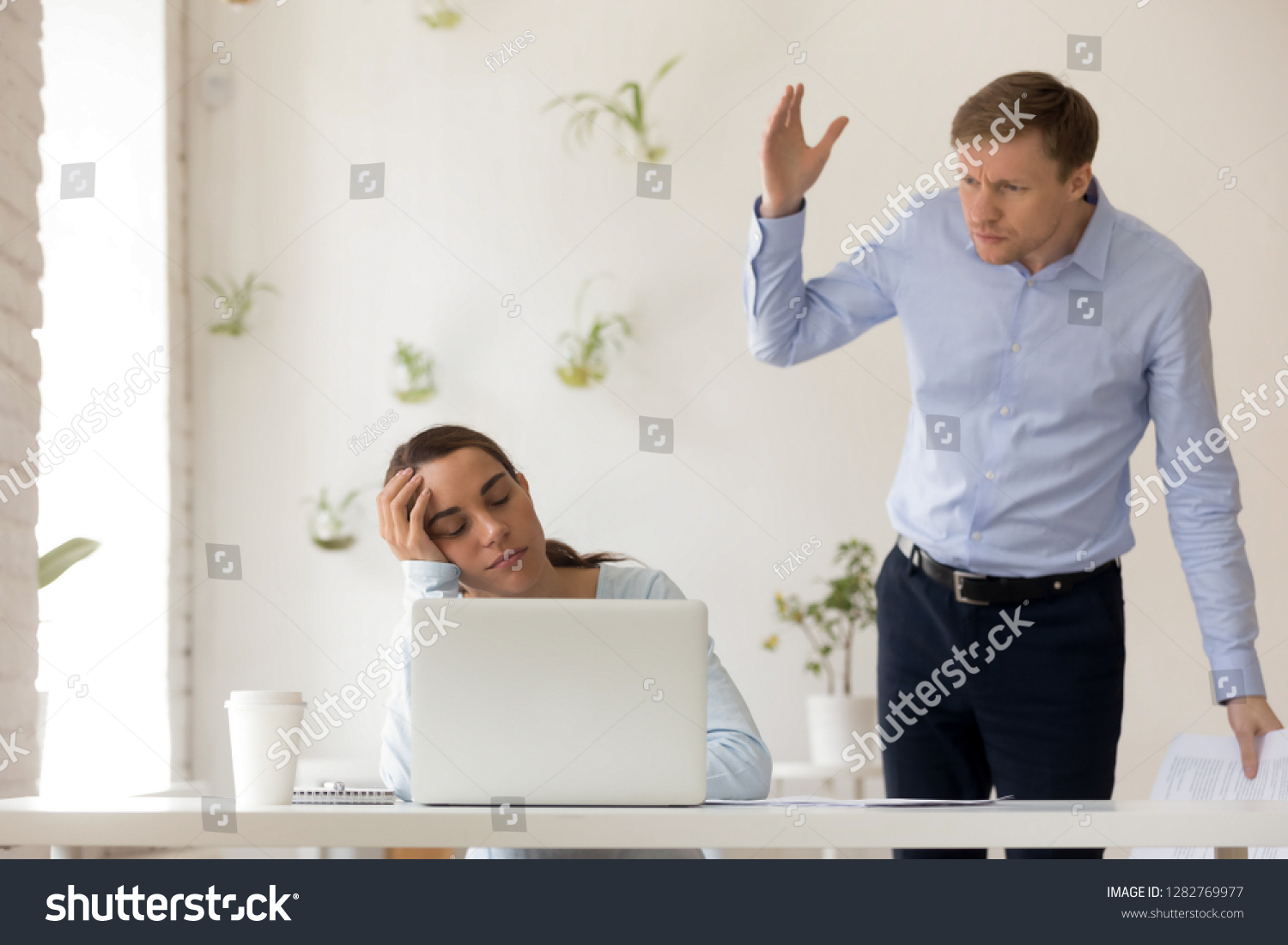 Manager having a 'quick thought' at an exhausted employee